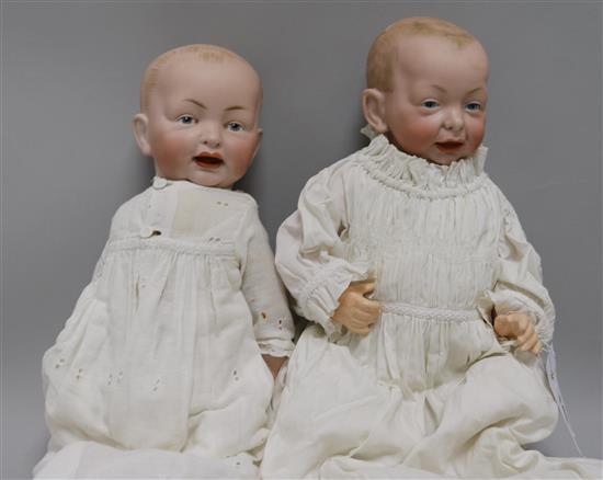 A Kammer & Reinhardt bisque head character doll, no. 36 and a similar doll, impressed marks G, 142 (2)